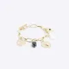 Gold charm chain bracelet sold by River Island