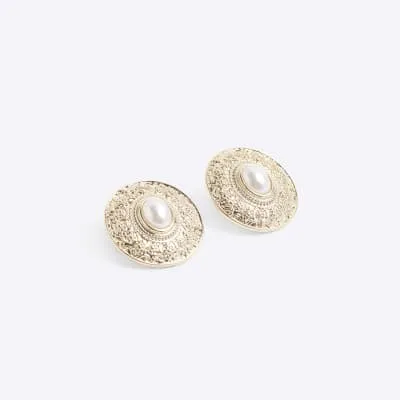 Gold pearl stud earrings sold by River Island