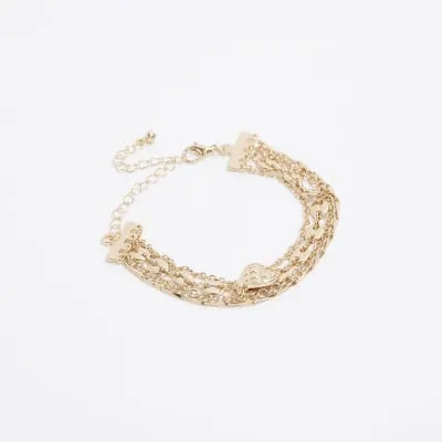 Gold hear chain link multirow bracelet sold by River Island