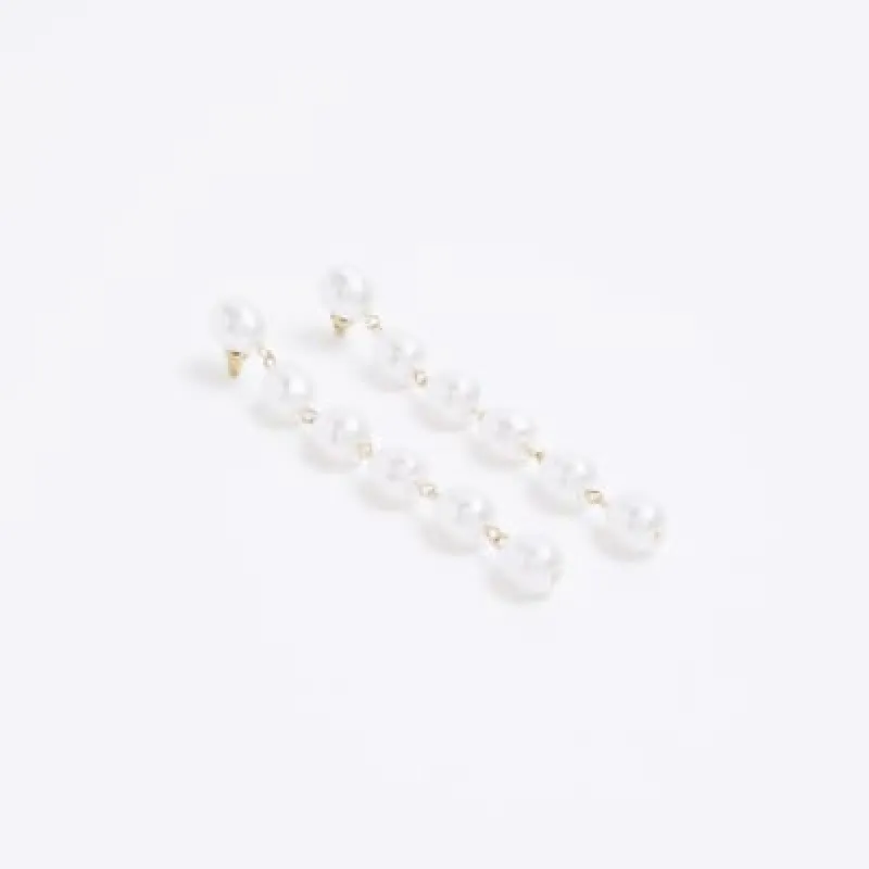 White pearl long drop earrings sold by River Island