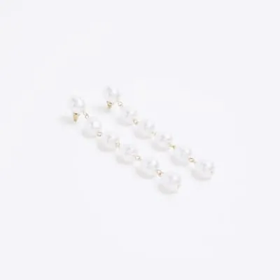 White pearl long drop earrings sold by River Island