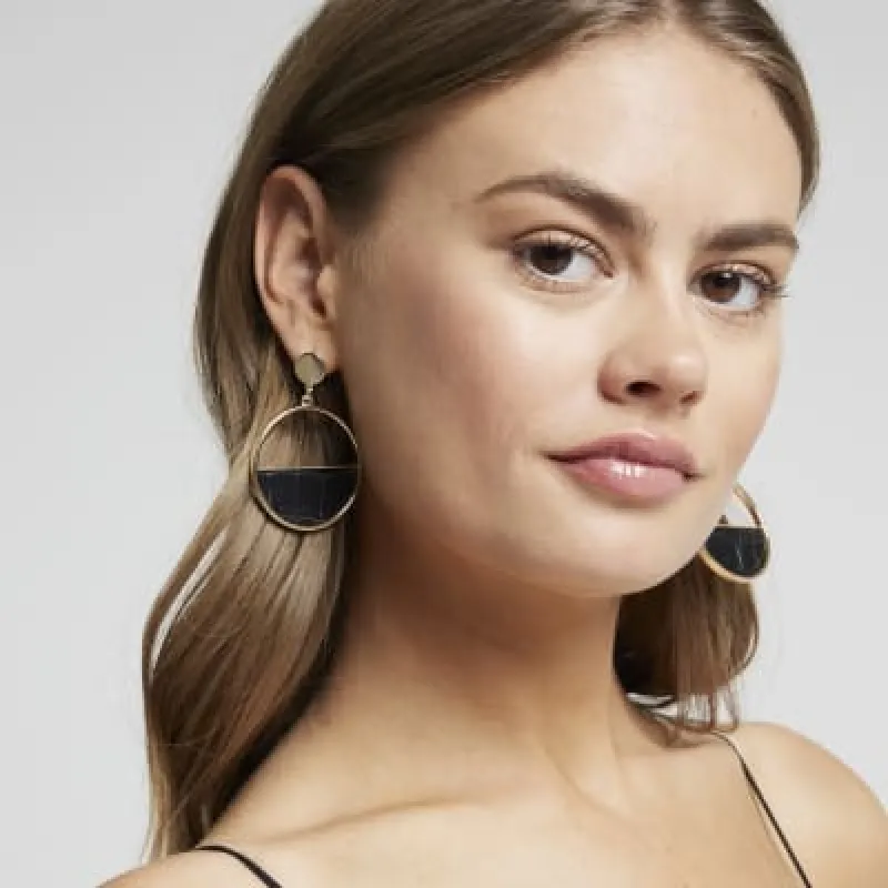 Gold croc embossed panel circle earrings sold by River Island