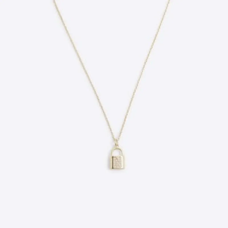 Gold N initial lock necklace sold by River Island