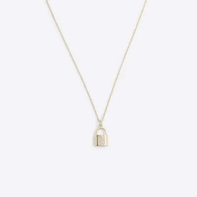 Gold N initial lock necklace sold by River Island