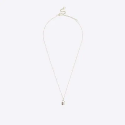 Gold C initial lock necklace sold by River Island