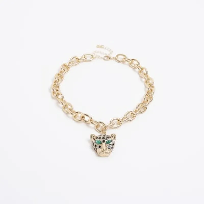 Gold leopard head necklace sold by River Island