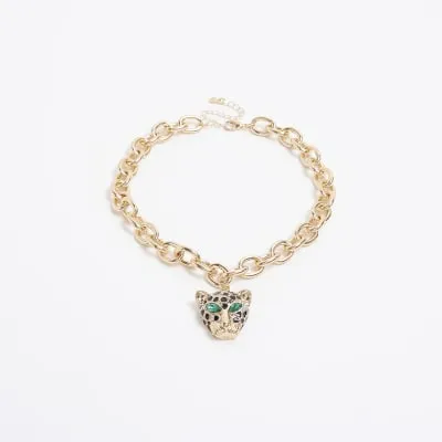 Gold leopard head necklace sold by River Island