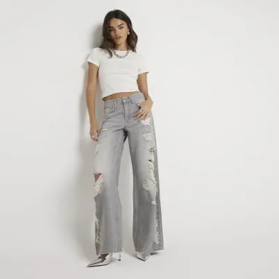 Grey low rise wide baggy ripped jeans sold by River Island