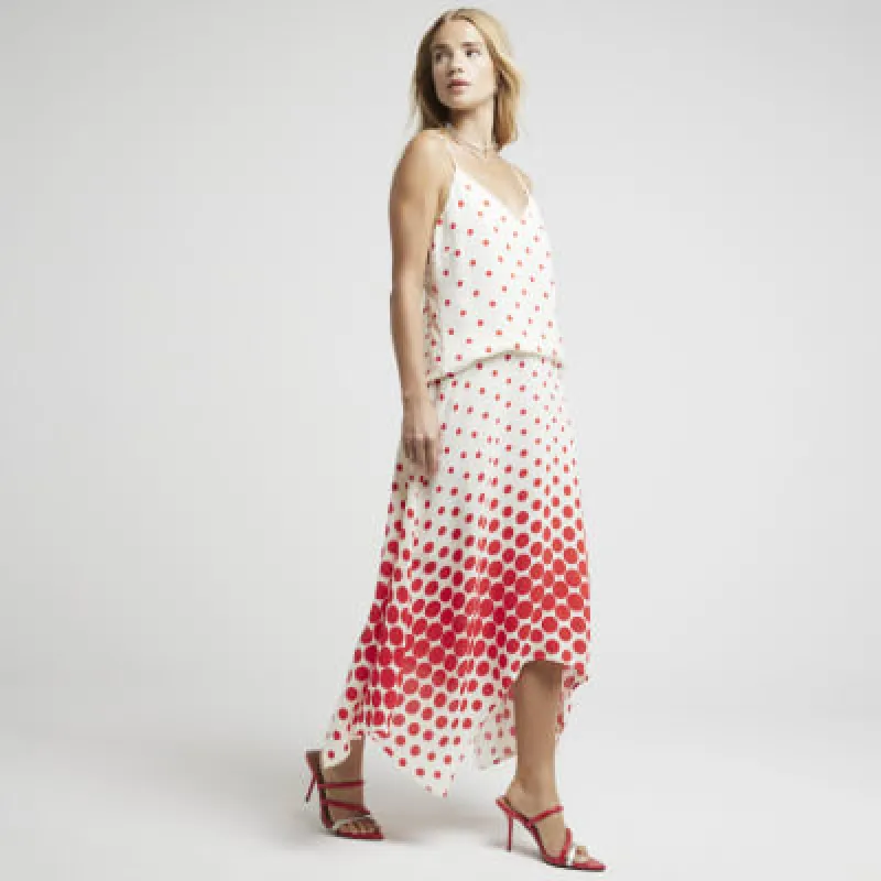 Red spot asymmetric midi skirt sold by River Island