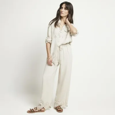 Stone linen blend broderie trousers sold by River Island