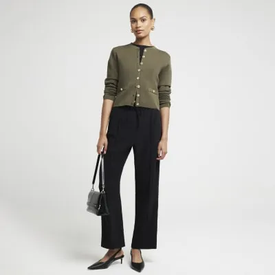 Black tailored joggers sold by River Island