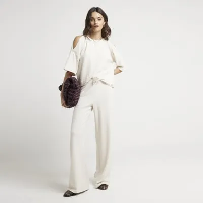 Cream Textured Wide Leg Trousers sold by River Island