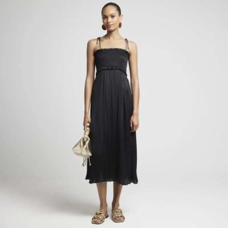 Black satin shirred slip midi dress sold by River Island
