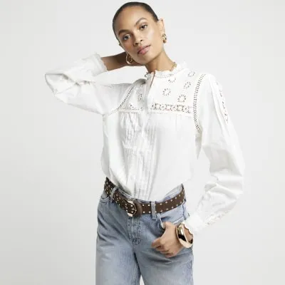 White pleated smock broderie blouse sold by River Island