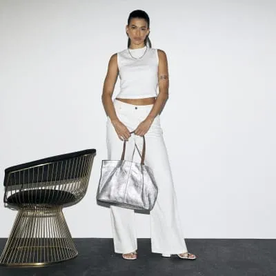 Silver metallic leather shopper bag sold by River Island