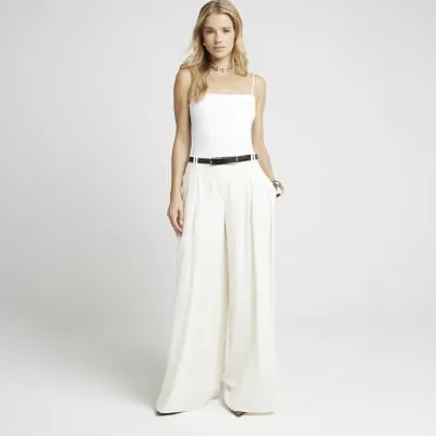 Cream pleated wide leg trousers sold by River Island