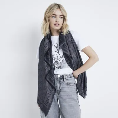 Black metallic monogram lightweight scarf sold by River Island