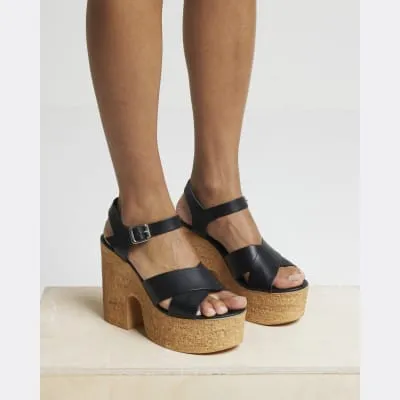 Black leather platform heeled sandals sold by River Island