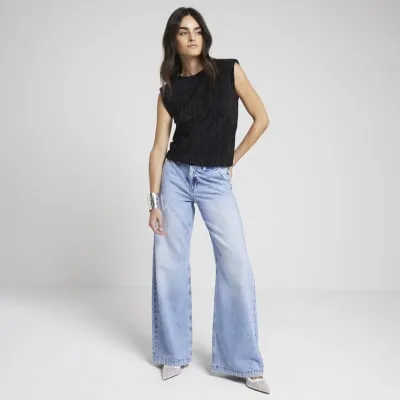 Black plisse shoulder pad top sold by River Island