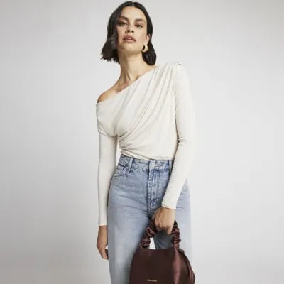 Cream drape off shoulder bodysuit sold by River Island