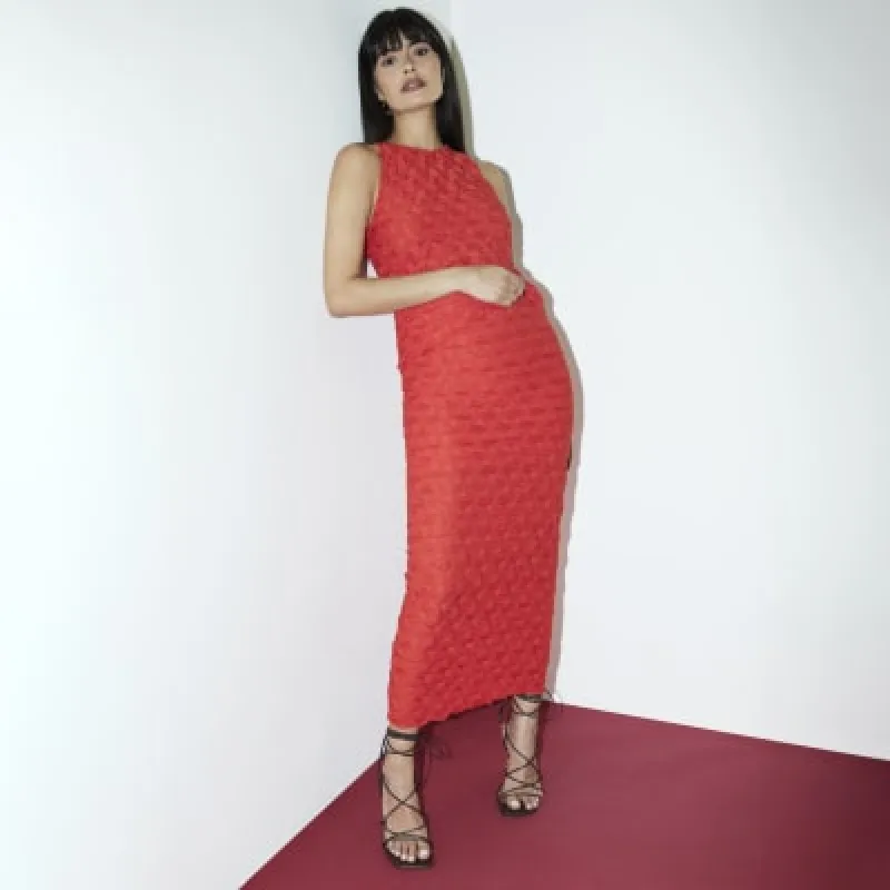 Red textured sleeveless top sold by River Island