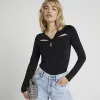 Black twist cut out long sleeve top sold by River Island