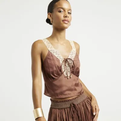 Brown satin lace trim top sold by River Island