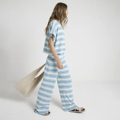 Blue crochet stripe wide leg trousers sold by River Island
