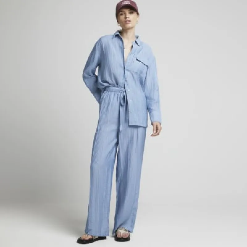 Blue textured wide leg trousers sold by River Island