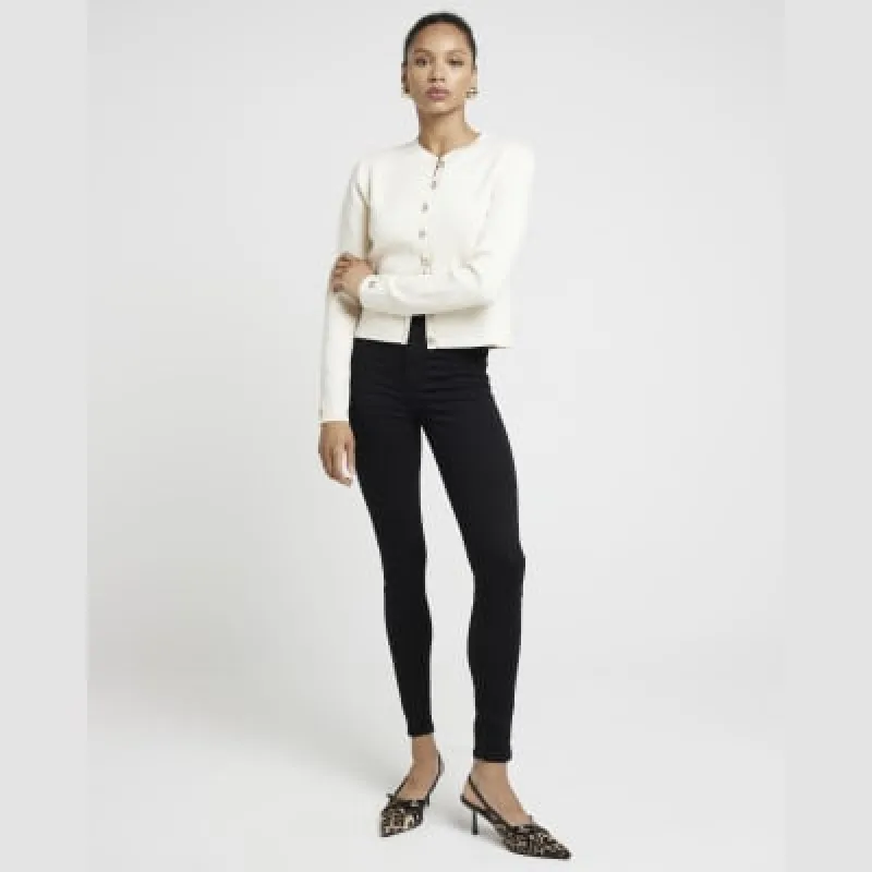 Black high waisted super skinny jeans sold by River Island