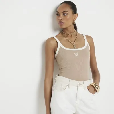 Beige tipped embroidered cami top sold by River Island