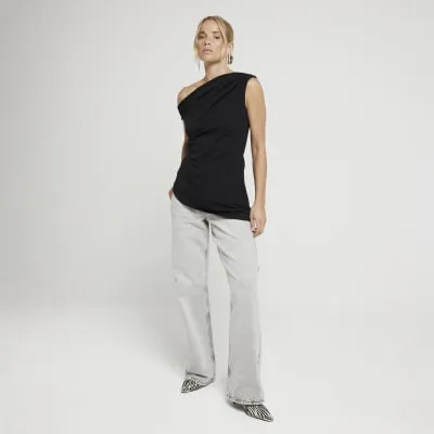 Black off shoulder asymmetric top sold by River Island