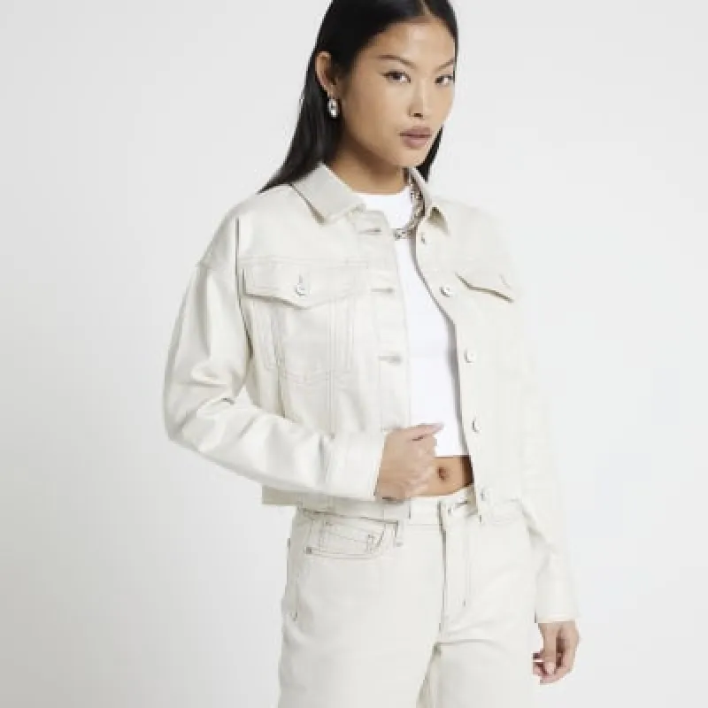 Petite beige glitter coated denim jacket sold by River Island