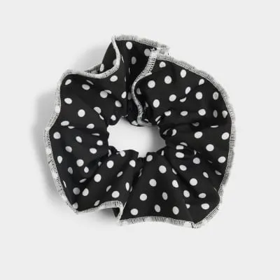 Black spot hair scrunchie sold by River Island