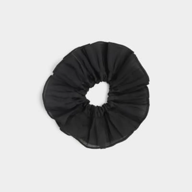 Black organza hair scrunchie sold by River Island