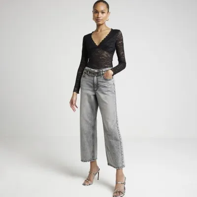 Black plunge lace bodysuit sold by River Island