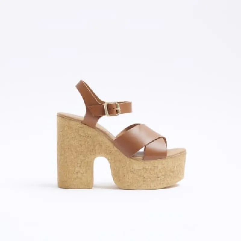 Brown leather platform heeled sandals sold by River Island
