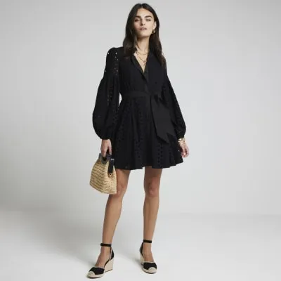 Black broderie belted mini shirt dress sold by River Island