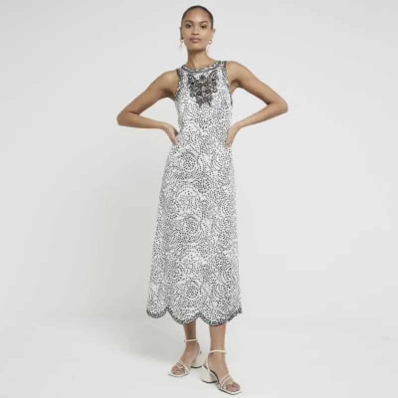 Cream spot broderie slip midi dress sold by River Island