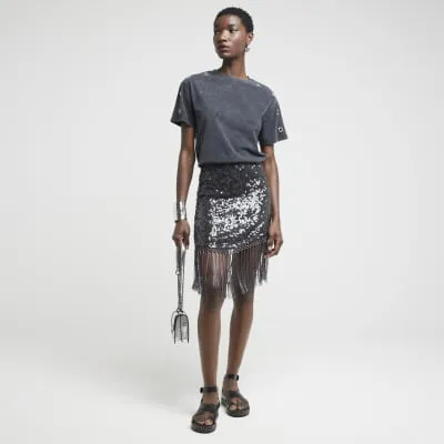 Black sequin fringe mini skirt sold by River Island