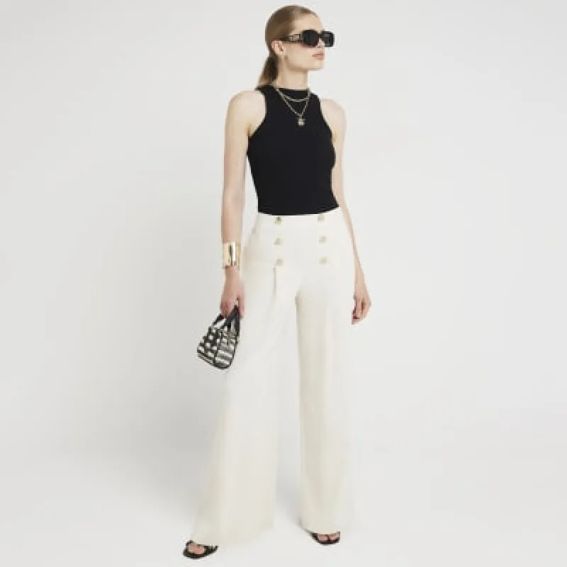 Cream button detail wide leg trousers sold by River Island