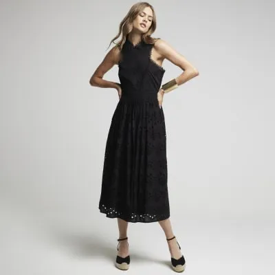 Black broderie cross neck smock midi dress sold by River Island