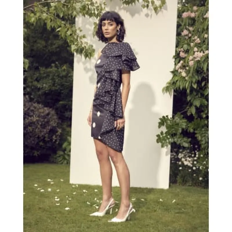 Black spot ruffle bodycon mini dress sold by River Island