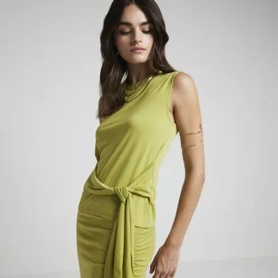 Green belted tank top sold by River Island