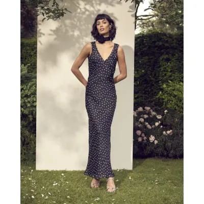 Black chiffon spot slip maxi dress sold by River Island