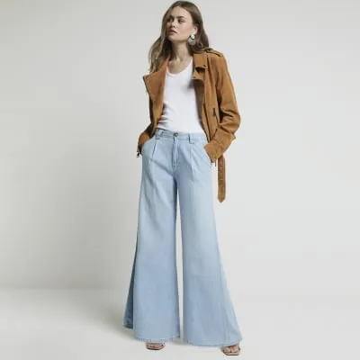 Blue mid rise tailored wide fit jeans sold by River Island