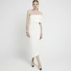 Cream asymmetric bodycon midi dress sold by River Island