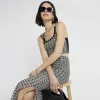 Black crochet geometric crop top sold by River Island