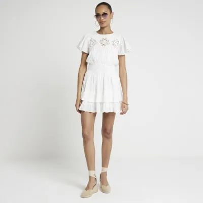 White cut out skater mini dress sold by River Island