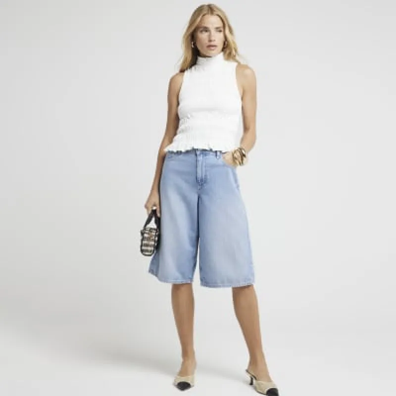 Cream shirred high neck top sold by River Island